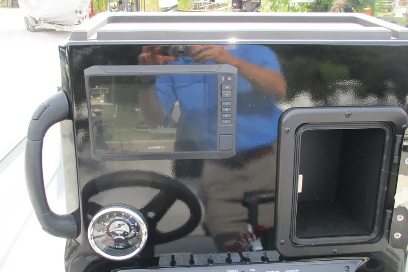 Slide: The Image of Control panel of 2027 Avid 20 Rogue CC boat with Garmin display and gauge. - 5
