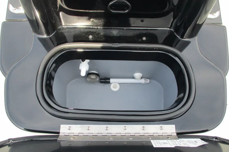 Slide: The Image of Livewell compartment of 2027 Avid 20 Rogue CC boat, featuring a black and gray interior. - 11