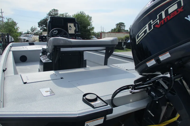 Slide: The Image of 2027 Avid 20 Rogue CC boat with powerful outboard motor, sleek design, and spacious deck. - 3