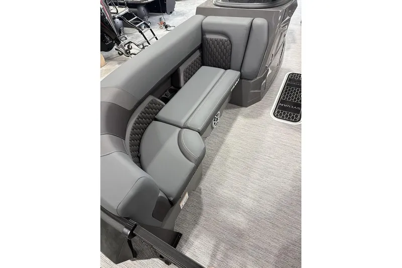 Slide: The Image of Luxurious seating in the 2026 Sylvan L-5 Platinum boat, featuring sleek gray upholstery. - 13