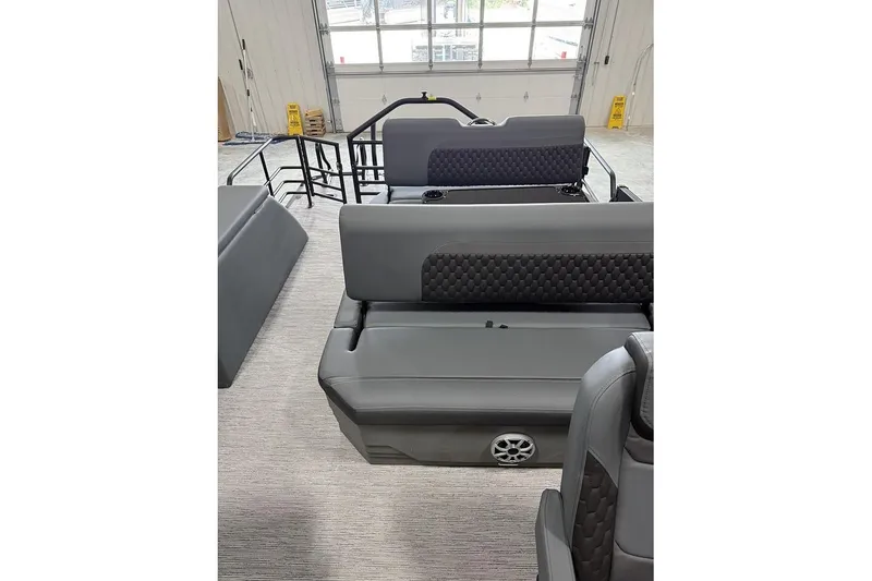 Slide: The Image of 2026 Sylvan L-5 Platinum boat interior with sleek gray seating and modern design. - 6
