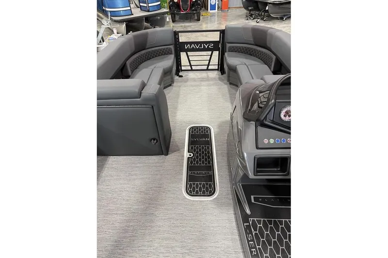 Slide: The Image of 2026 Sylvan L-5 Platinum boat interior with sleek gray seating and modern dashboard design. - 11
