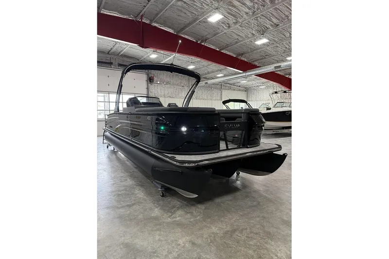 Slide: The Image of 2026 Sylvan L-5 Platinum pontoon boat in a showroom, showcasing sleek design and modern features. - 15