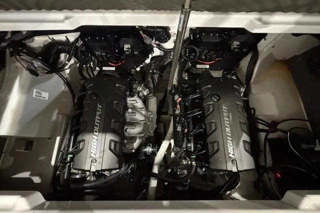 Slide: The Image of 2021 Yamaha Boats 252SE engine compartment with dual high-output engines. - 13