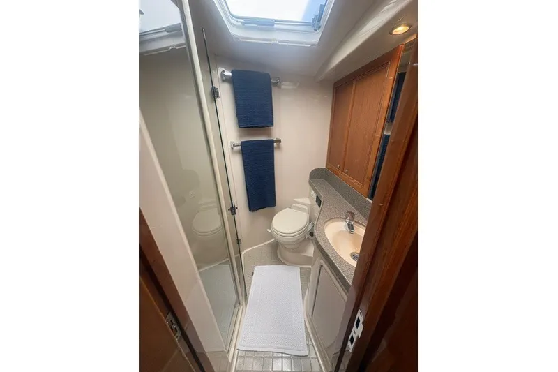 Slide: The Image of Luxurious bathroom in 2007 Riviera 51 Enclosed Flybridge yacht with shower and vanity. - 29