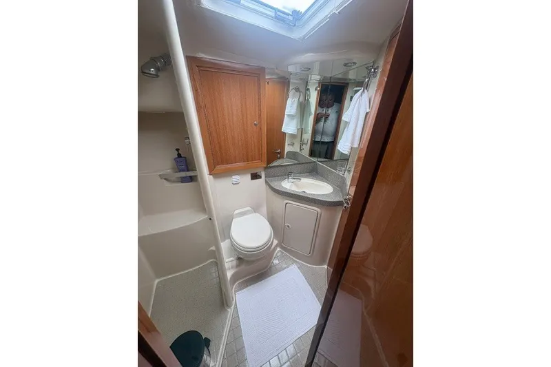Slide: The Image of Bathroom interior of 2007 Riviera 51 Enclosed Flybridge yacht, featuring modern amenities. - 24