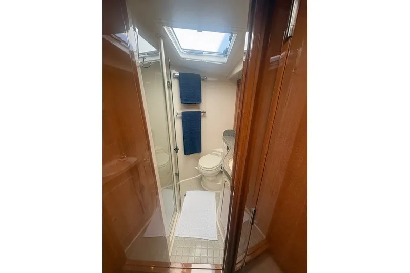 Slide: The Image of Luxurious bathroom in 2007 Riviera 51 Enclosed Flybridge yacht with modern amenities. - 31