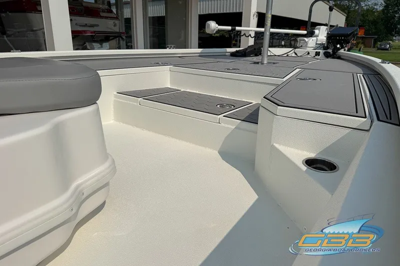 Slide: The Image of 2022 Avid 23 FS boat interior with seating and storage compartments. - 18