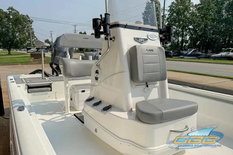 Slide: The Image of 2022 Avid 23 FS boat interior with seating and console, displayed at Georgia Boat Brokers. - 8
