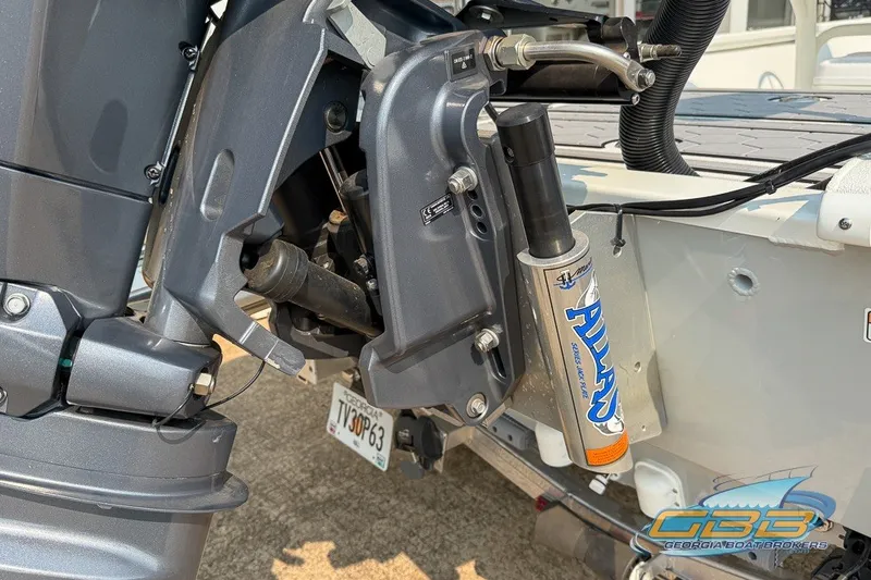 Slide: The Image of Boat engine detail of 2022 Avid 23 FS with hydraulic components. - 21