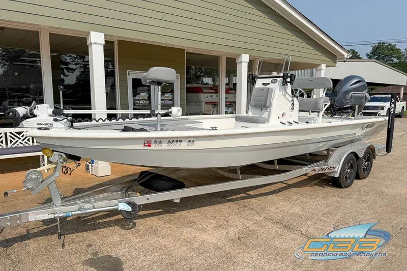 Slide: The Image of 2022 Avid 23 FS boat on trailer at Georgia Boat Brokers dealership. - 2