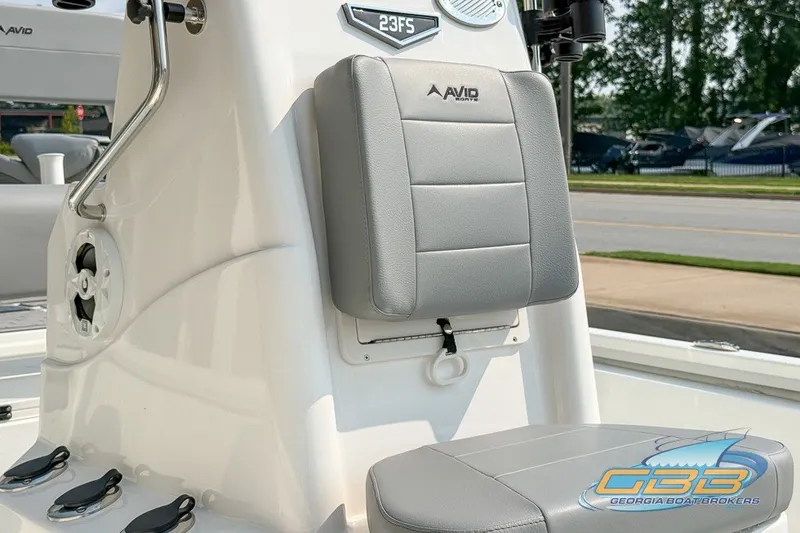 Slide: The Image of 2022 Avid 23 FS boat interior with gray seating and Georgia Boat Brokers logo. - 9