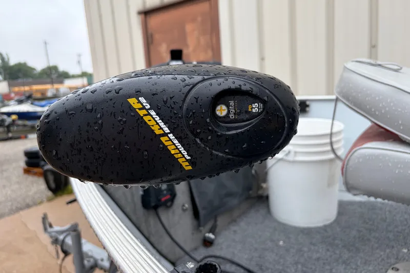 Slide: The Image of Minn Kota PowerDrive V2 motor on a 1989 Lund 16 Pike SS boat, wet with raindrops. - 3