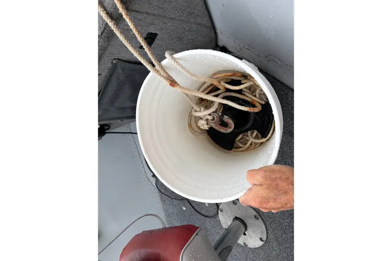 Slide: The Image of Bucket with rope and anchor on 1989 Lund 16 Pike SS boat deck. - 6