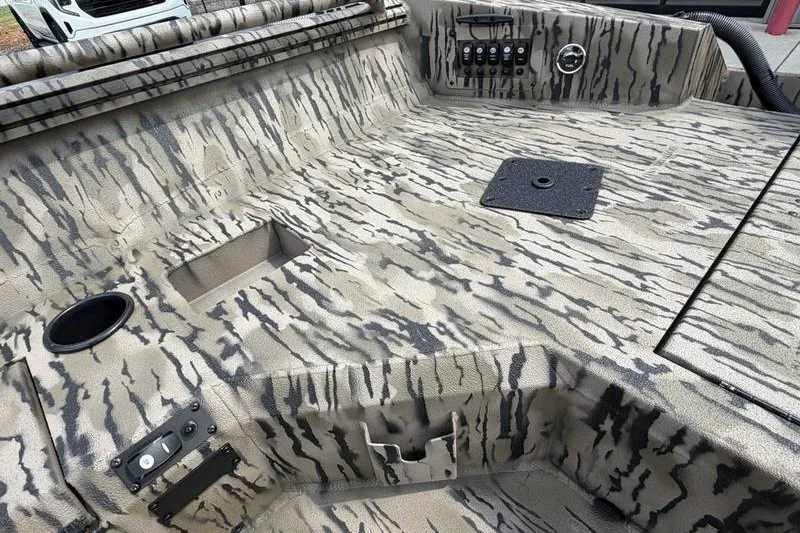 Slide: The Image of Interior of 2027 Excel 183 Tomahawk boat with camouflage design and control panel. - 22