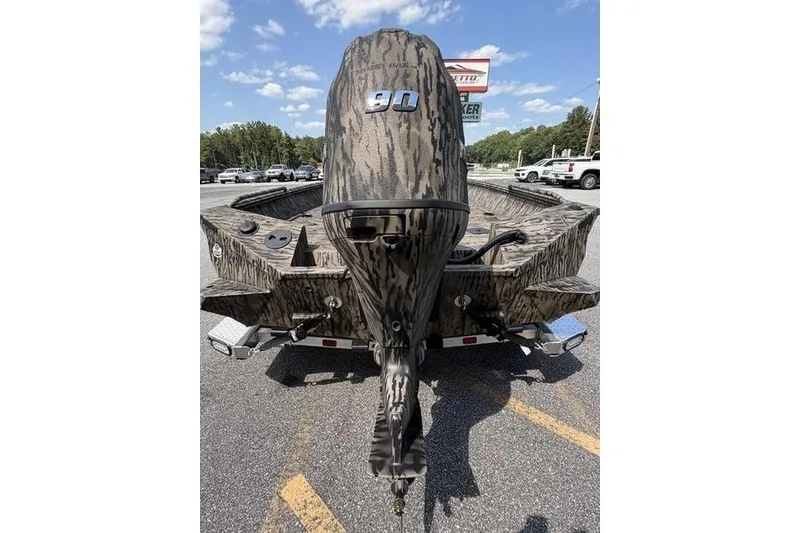 Slide: The Image of 2027 Excel 183 Tomahawk boat with camouflage design and 90 HP outboard motor. - 11