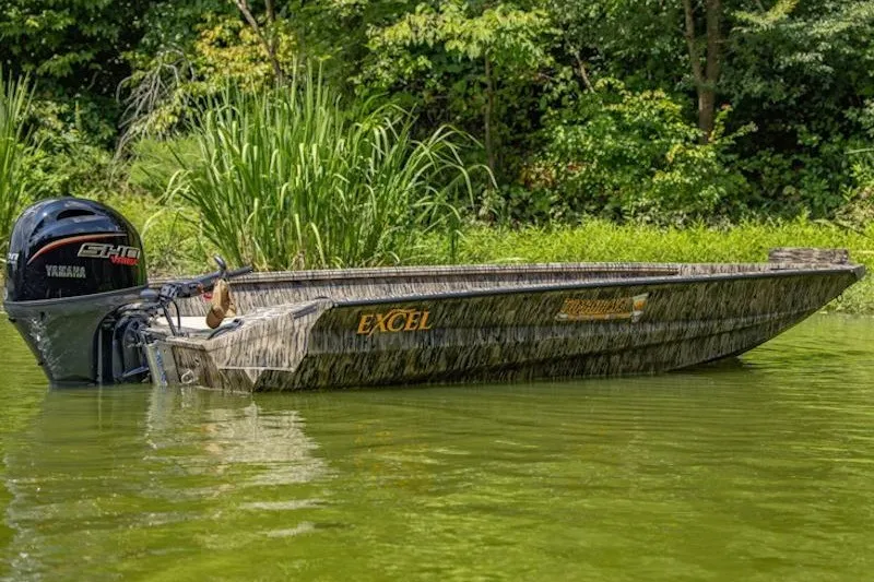 The Image of 2027 Excel 183 Tomahawk boat with Yamaha motor on a serene lake. - 20