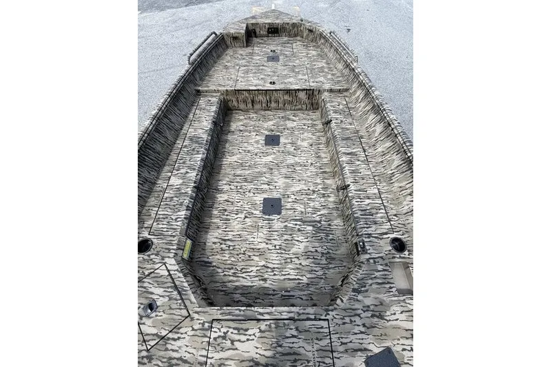 Slide: The Image of 2027 Excel 183 Tomahawk boat interior with camouflage design, featuring spacious seating and storage. - 18