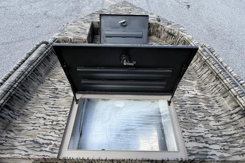 Slide: The Image of Camouflage-patterned Excel 183 Tomahawk boat interior with open storage compartment, 2027 model. - 8
