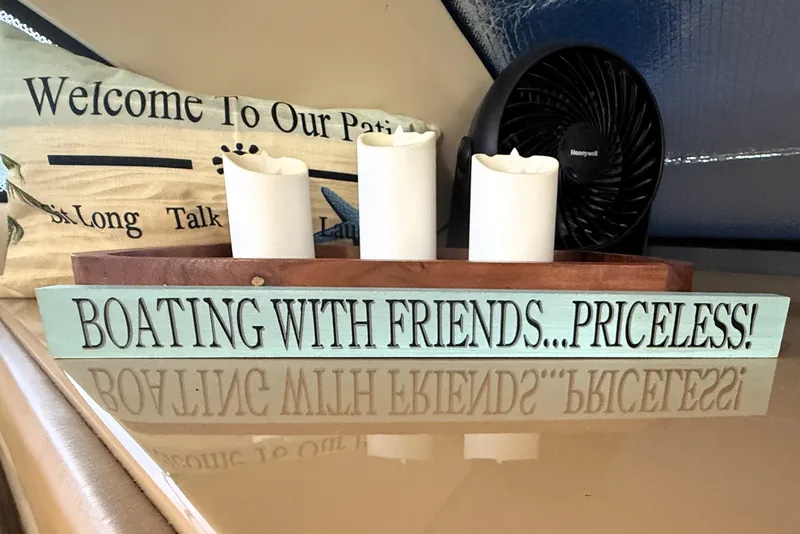 Slide: The Image of Decorative sign on Carver 366 Motor Yacht, 2003: "Boating with Friends... Priceless!" - 28