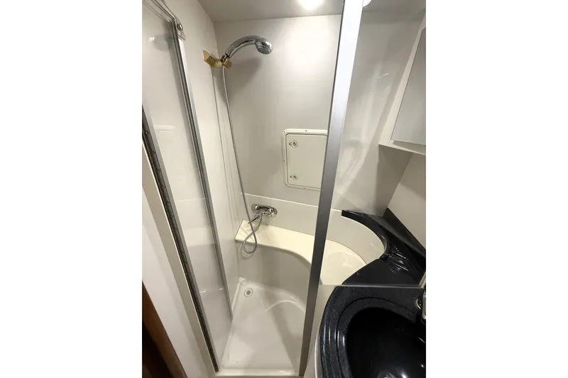 Slide: The Image of Shower area in 2003 Carver 366 Motor Yacht with modern fixtures and sleek design. - 19