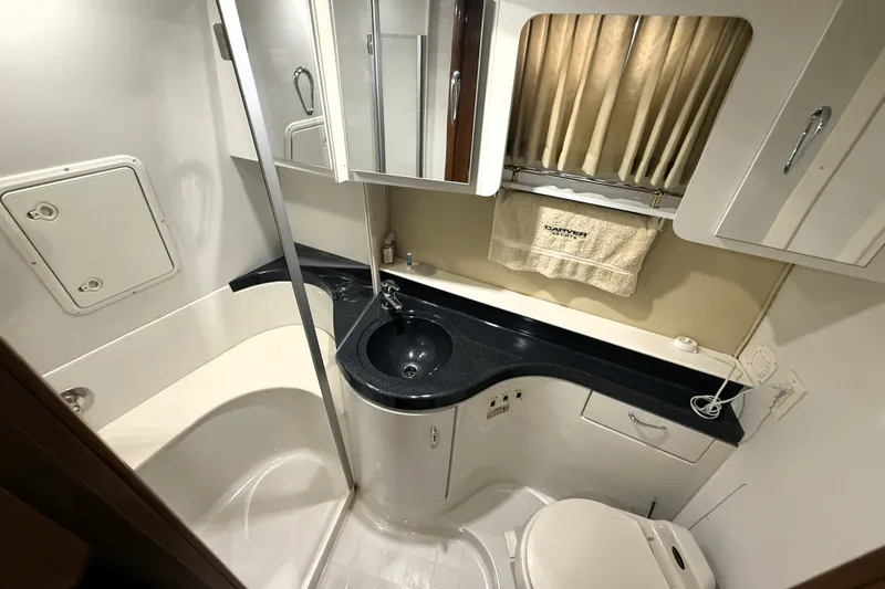 Slide: The Image of Bathroom interior of 2003 Carver 366 Motor Yacht with sink, toilet, and shower. - 18