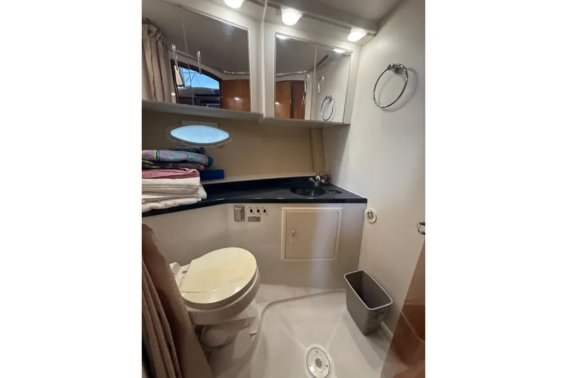 Slide: The Image of Bathroom interior of 2003 Carver 366 Motor Yacht with sink, toilet, and mirror. - 22