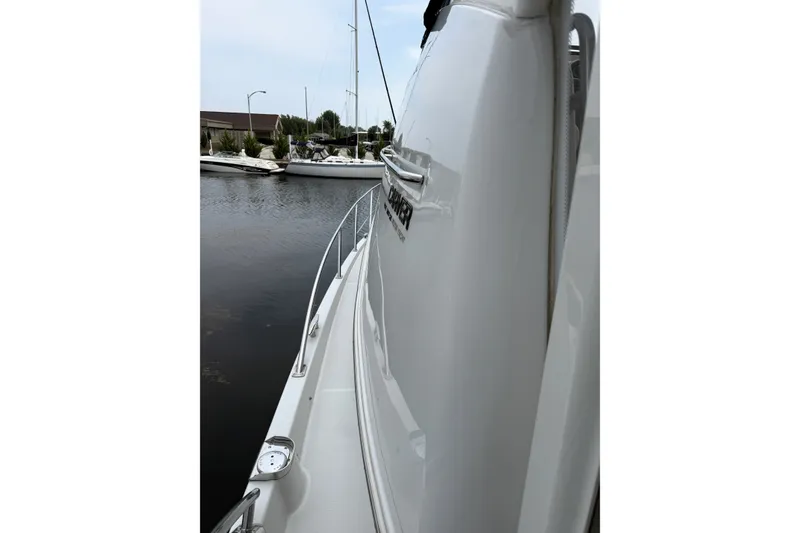 Slide: The Image of Side view of a 2003 Carver 366 Motor Yacht docked at a marina. - 23
