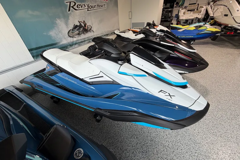 The Image of 2026 Yamaha WaveRunner FX HO in showroom, sleek design, blue and white color scheme. - 1