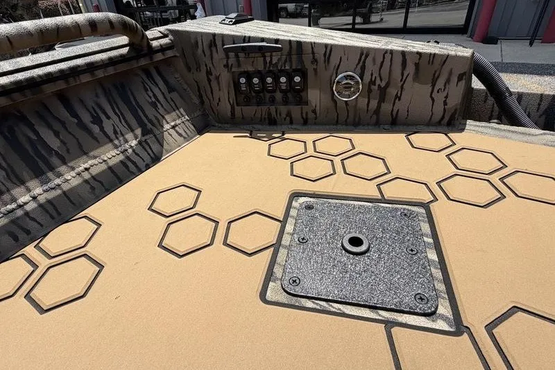 Slide: The Image of Interior of 2027 Excel 183 Tomahawk boat with hexagonal pattern design. - 26