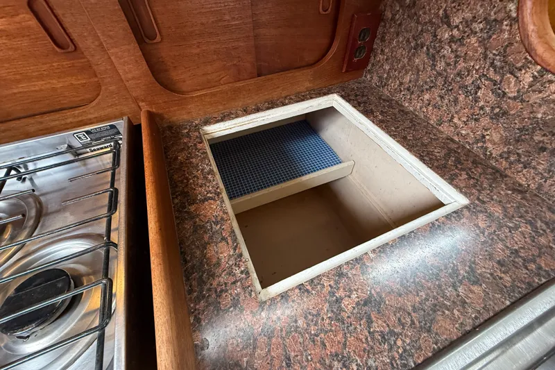Slide: The Image of 1974 Spencer 53 yacht interior with granite countertop and stove. - 50