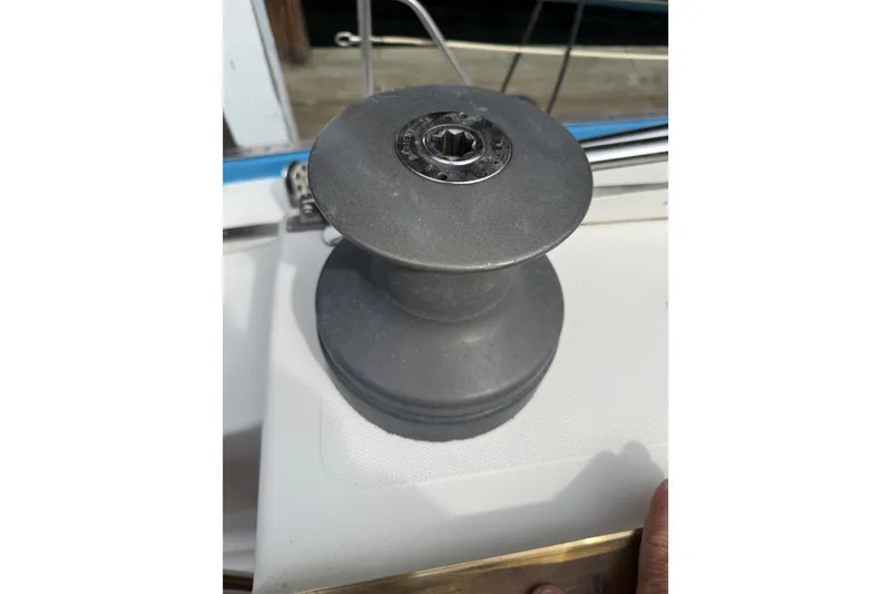 Slide: The Image of Sailboat winch on a 1974 Spencer 53, used for adjusting sails. - 48