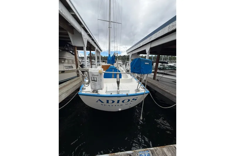 Slide: The Image of 1974 Spencer 53 sailboat docked in Seattle marina, named "Adios." - 66