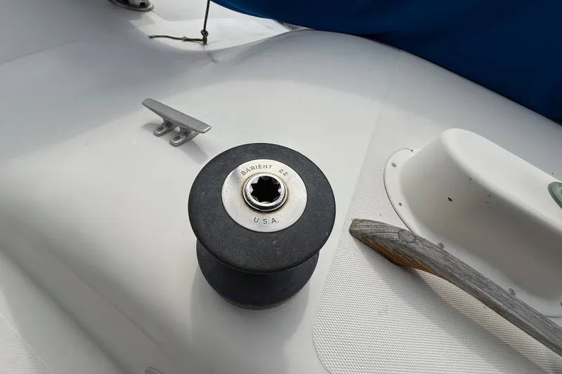 Slide: The Image of Deck of a 1974 Spencer 53 sailboat featuring a Barient winch and cleat. - 47