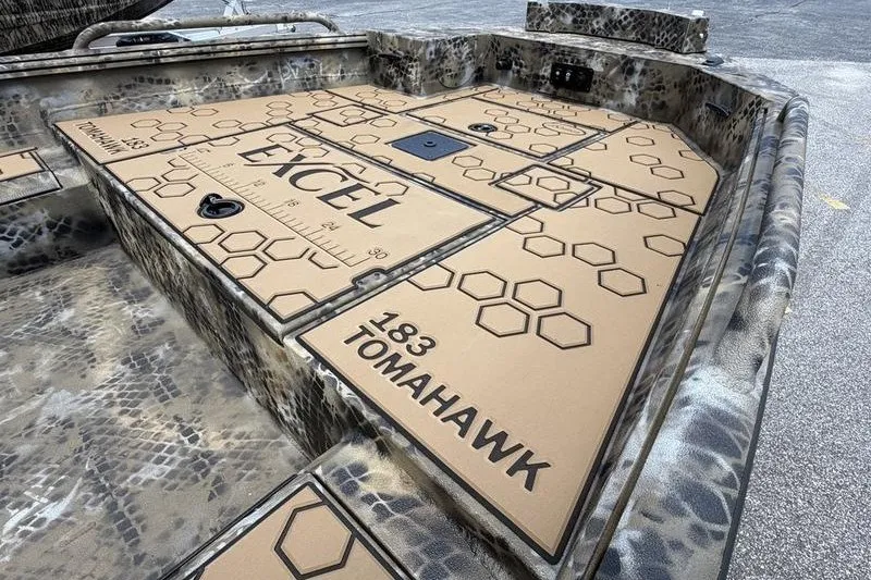 Slide: The Image of 2027 Excel 183 Tomahawk boat deck with hexagonal pattern and camouflage design. - 20
