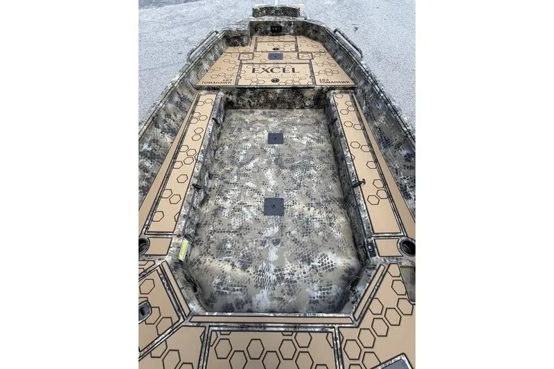 Slide: The Image of 2027 Excel 183 Tomahawk boat interior with hexagonal pattern and camouflage design. - 30