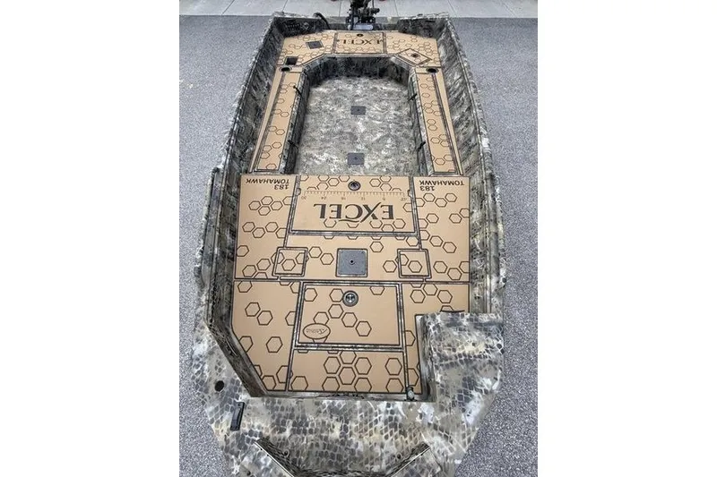 Slide: The Image of 2027 Excel 183 Tomahawk boat with camouflage design and hexagonal pattern flooring. - 10