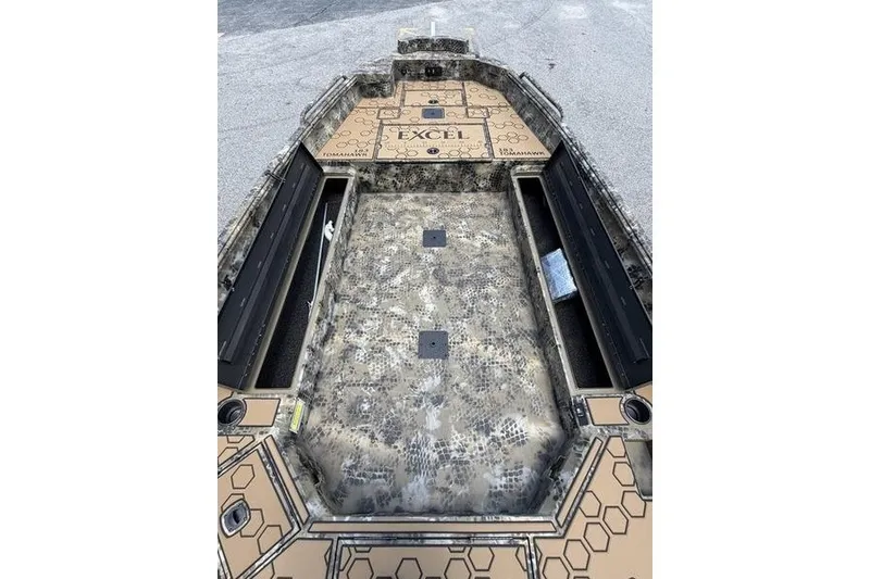 Slide: The Image of 2027 Excel 183 Tomahawk boat interior with camouflage design and spacious deck layout. - 27