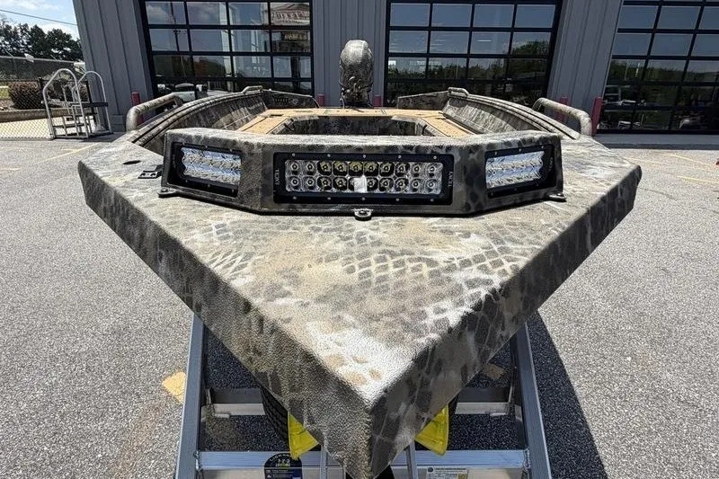 Slide: The Image of Front view of 2027 Excel 183 Tomahawk boat with camouflage design and LED lights. - 15