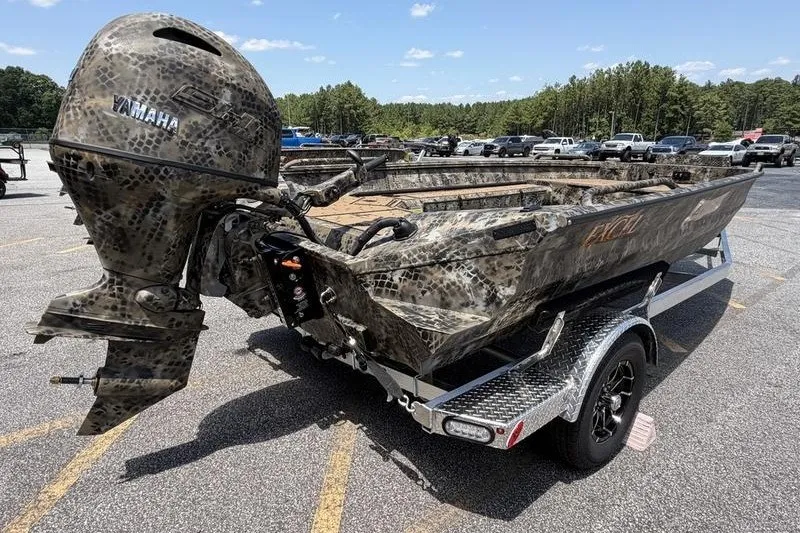 Slide: The Image of Camouflage-patterned Excel 183 Tomahawk boat with Yamaha motor on a trailer, 2027 model. - 7