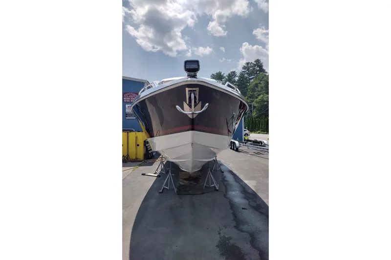 Slide: The Image of 2020 Formula 350 Crossover Bowrider on display, front view under a cloudy sky. - 7