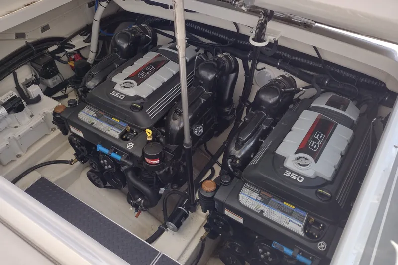 Slide: The Image of Twin 6.2L engines in a 2020 Formula 350 Crossover Bowrider boat. - 56