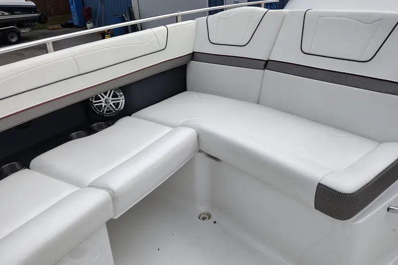 Slide: The Image of 2020 Formula 350 Crossover Bowrider interior with white cushioned seating and speaker detail. - 20