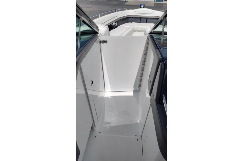 Slide: The Image of 2020 Formula 350 Crossover Bowrider interior walkway with seating area. - 58