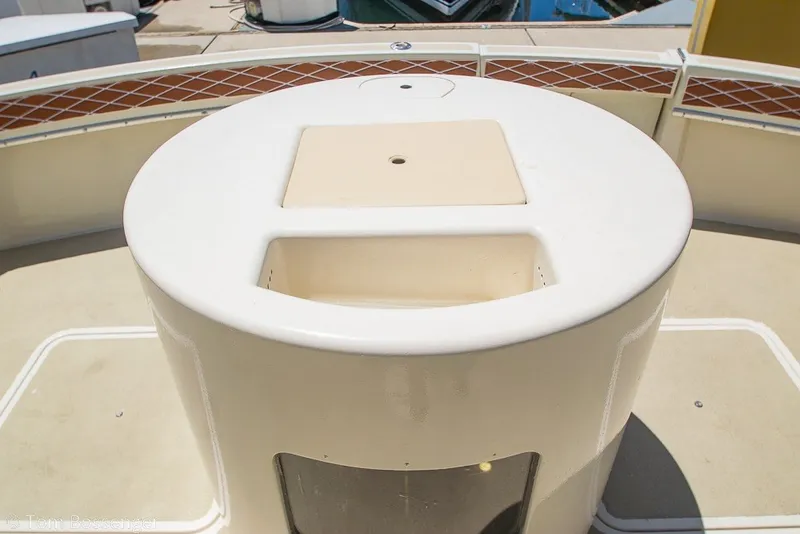 Slide: The Image of 1987 Hatteras 52 Convertible yacht deck with circular seating area. - 39