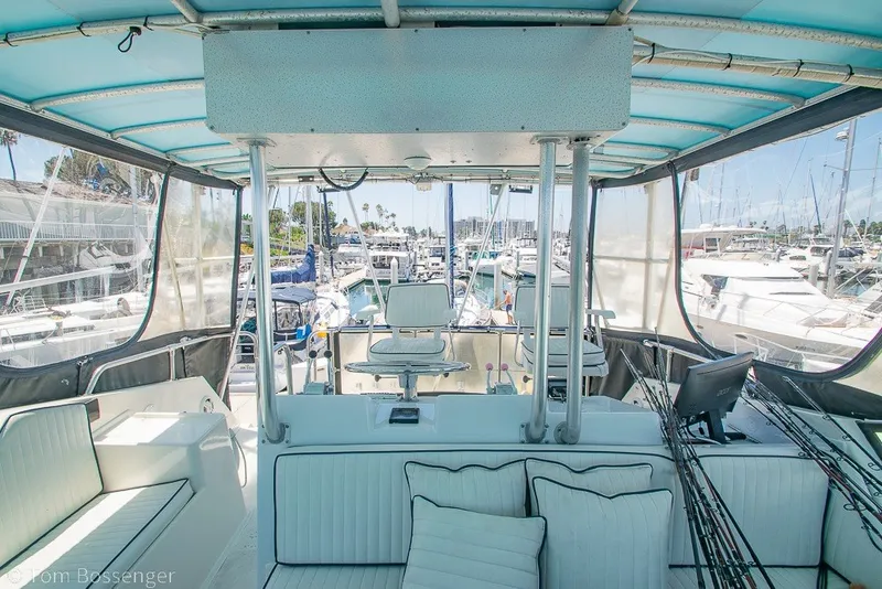 Slide: The Image of Interior view of 1987 Hatteras 52 Convertible yacht with seating and helm station. - 50