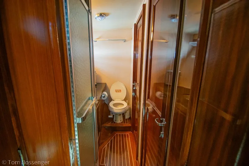 Slide: The Image of Bathroom interior of 1987 Hatteras 52 Convertible yacht with wooden finishes. - 35