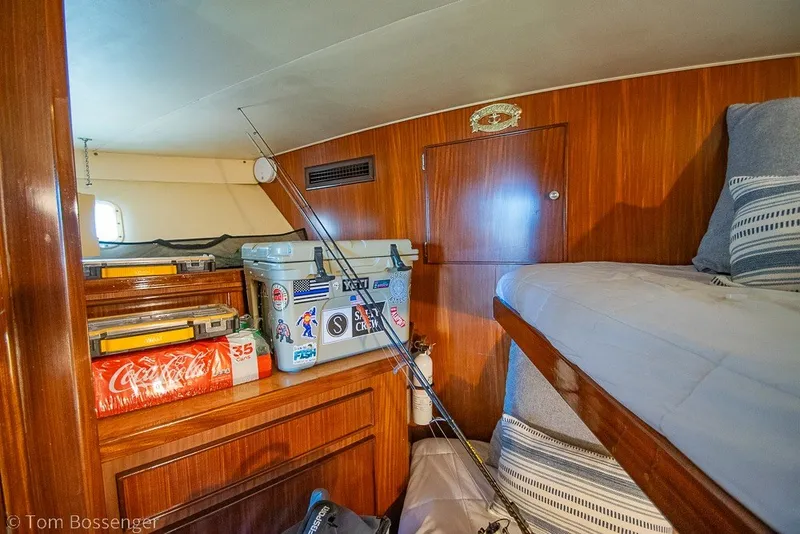 Slide: The Image of Interior cabin of 1987 Hatteras 52 Convertible with fishing gear and cooler. - 32