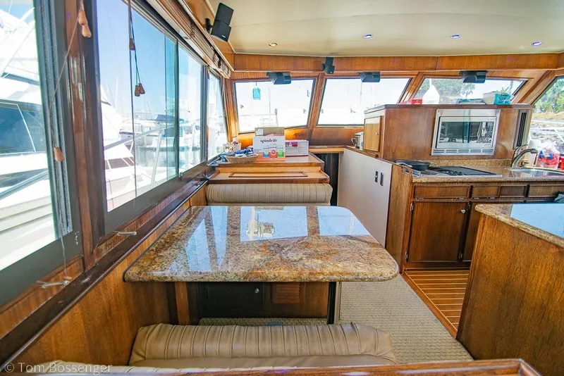 Slide: The Image of Interior of 1987 Hatteras 52 Convertible yacht with wood finishes and granite countertops. - 20
