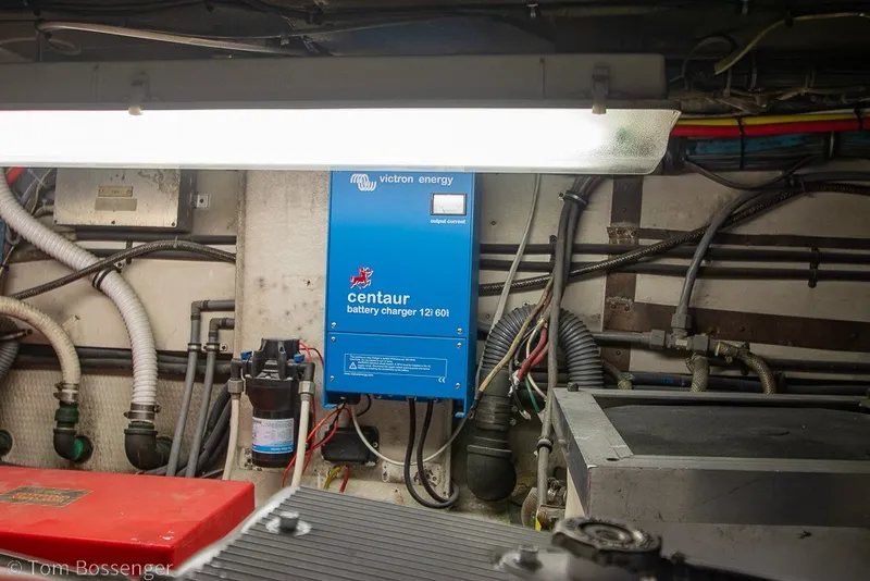 Slide: The Image of Engine room of 1987 Hatteras 52 Convertible with Victron Energy Centaur battery charger. - 67